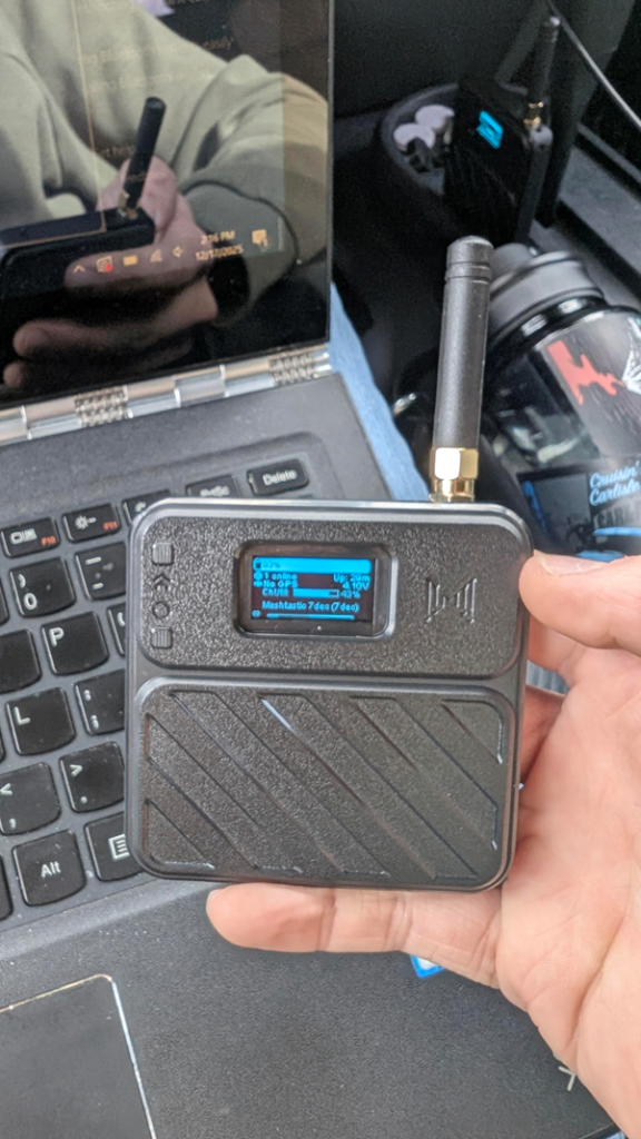 one of my mesh network communicators being held in my hand.